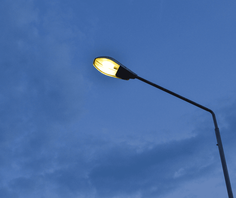 Lit Street Light in Front of Dark Sky