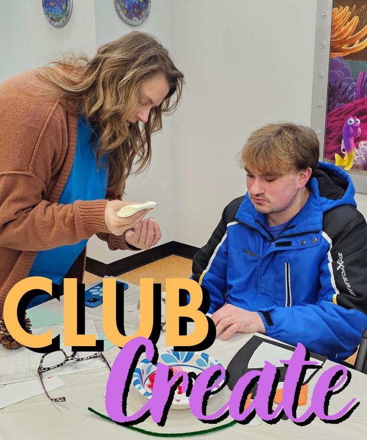 Club Create Instructor helping glue together a craft